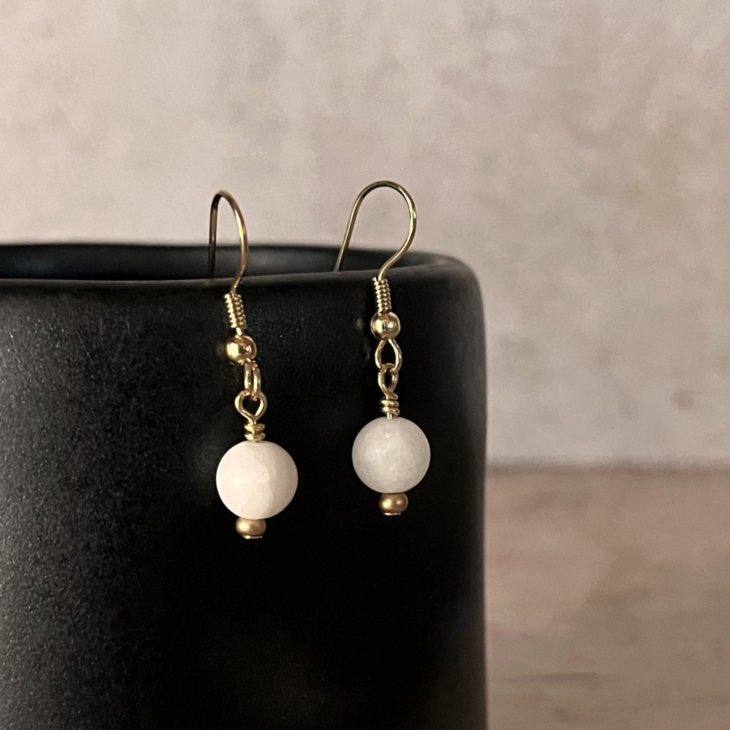 Gold drop earrings with white jade bead